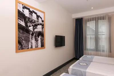 a hotel room with a bed and a picture on the wall at Premist Hotels Taksim in Istanbul