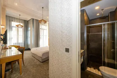 a hotel room with a bed and a bathroom at Premist Hotels Taksim in Istanbul