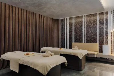 a treatment room with two beds with towels on them at Le Meridien Istanbul Etiler in Istanbul