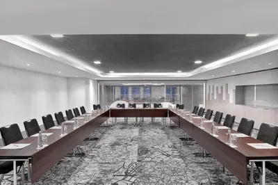 a large conference room with a long table and chairs at Le Meridien Istanbul Etiler in Istanbul