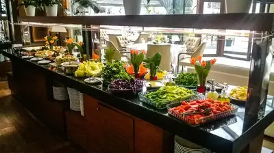 a buffet line with many different fruits and vegetables at Paradise Island Hotel in Gebze