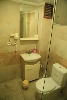 a bathroom with a toilet and a sink and a shower at holiday family apart in Istanbul