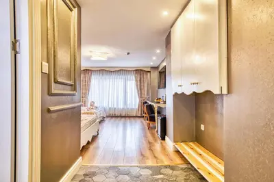 a hallway with a room with a bed and a window at Sirkeci Ersu Hotel & SPA in Istanbul