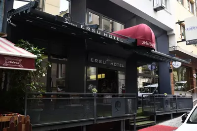 a front view of a restaurant with a red awning at Sirkeci Ersu Hotel & SPA in Istanbul
