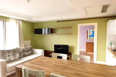 a living room with a table and a couch at Taba Luxury Suites and Hotel in Istanbul