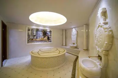 a bathroom with a large tub in the middle of the room at Taba Luxury Suites and Hotel in Istanbul