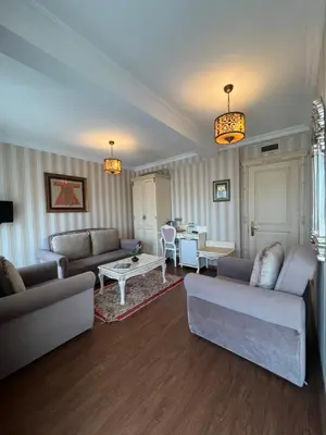 a living room with couches and a table at Muyan Suites in Istanbul