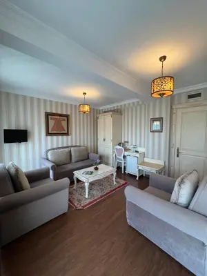 a living room with two couches and a table at Muyan Suites in Istanbul