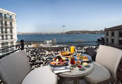a tray of food on a table on a balcony at The Wings Hotels Karakoy in Istanbul