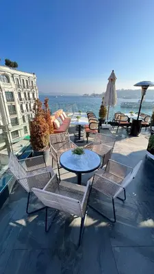 a group of chairs and a table on a patio at The Wings Hotels Karakoy in Istanbul
