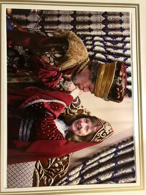 a painting of two people laying on a bed at Happy Suite Boutique Hotel in Istanbul