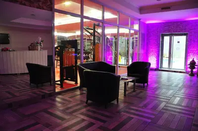 a purple room with chairs and a table with purple lighting at Eser Diamond Hotel Spa & Convention Center İstanbul in Silivri