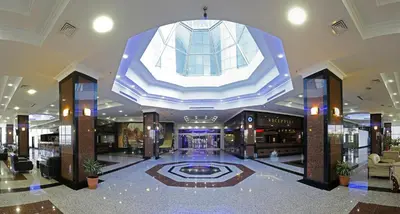 a lobby with a large building with a large ceiling at Eser Diamond Hotel Spa & Convention Center İstanbul in Silivri