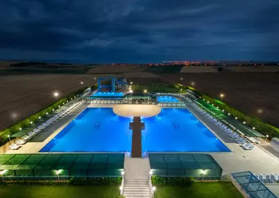 an overhead view of a swimming pool at night at Eser Diamond Hotel Spa & Convention Center İstanbul in Silivri