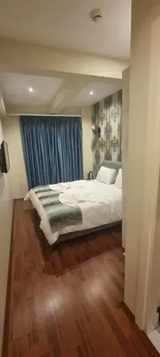 a bedroom with a large white bed and wooden floors at By Historial Hotel Due in Istanbul