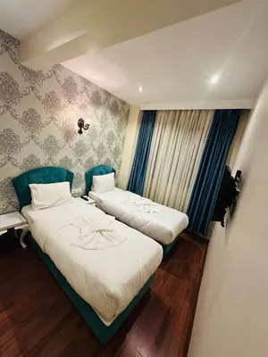 a room with two beds in a room with at By Historial Hotel Due in Istanbul