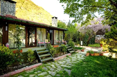 a house with a stone pathway leading to a yard at Park Mandalin Hotel - Adult only in Agva
