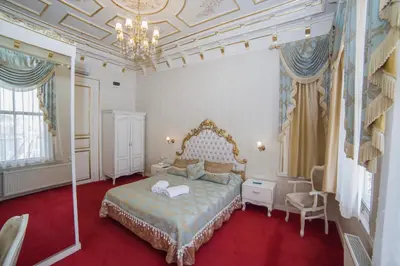 a bedroom with a bed and a chandelier at HHK Hotel in Istanbul