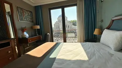 a hotel room with a bed and a window at Grand Durmaz Hotel in Istanbul