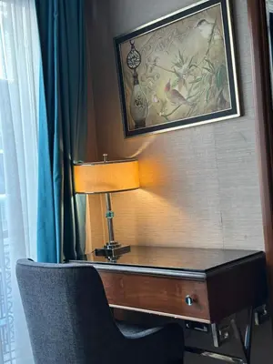 a desk with a lamp and a chair in a room at Grand Durmaz Hotel in Istanbul