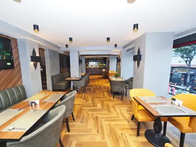 a dining room with wooden tables and chairs at Best House Hotel OLD TOWN in Istanbul