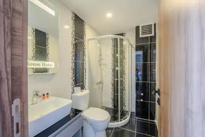 a bathroom with a toilet and a shower and a sink at Best House Hotel OLD TOWN in Istanbul