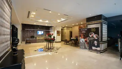 a living room with a lobby with a table at Grand Makel Hotel Topkapi in Istanbul