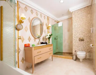 a bathroom with a shower and a sink and a toilet at Grand Makel Hotel Topkapi in Istanbul