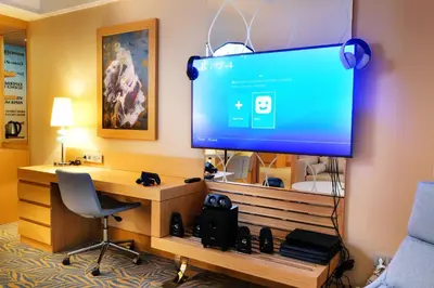 a room with a large screen television in a hotel room at TRYP by Wyndham Izmit in Kocaeli