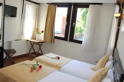 a bedroom with two beds with flowers on them at Sultans Hotel in Istanbul