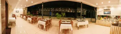 a dining room with tables and chairs in a restaurant at Ceylan Hotel in Bursa