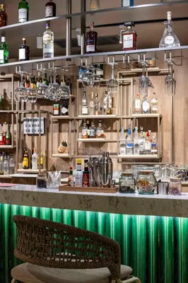 a bar with green lighting in a restaurant at Opera Hotel Bosphorus - Preferred Hotels and Resorts in Istanbul