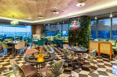 a restaurant with tables and chairs and a wall of windows at Opera Hotel Bosphorus - Preferred Hotels and Resorts in Istanbul