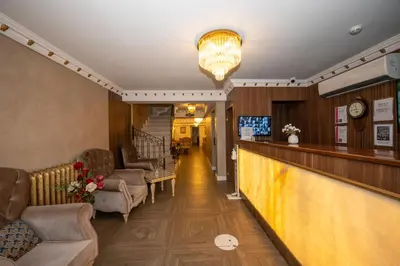 a hotel lobby with a bar and chairs at Hotel Melita in Istanbul