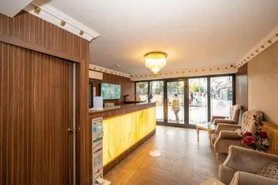 a lobby of a hotel with a bar and chairs at Hotel Melita in Istanbul