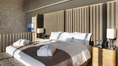a bedroom with a large bed with white pillows at DoubleTree by Hilton Istanbul-Avcilar in Istanbul