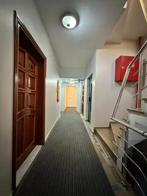 a hallway with a door and a carpeted floor at Bade Boutique Hotel Kadıköy in Istanbul