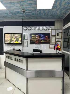 a counter in a room with two monitors on a wall at Bade Boutique Hotel Kadıköy in Istanbul