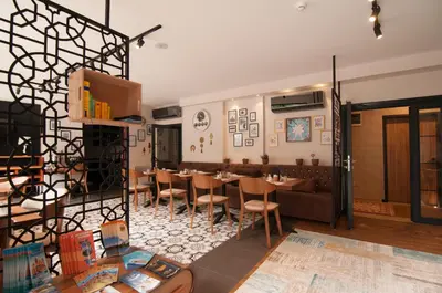 a restaurant with a dining room with tables and chairs at Nomade Hotel Exclusive in Istanbul