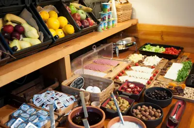 a table filled with different types of vegetables and fruits at Nomade Hotel Exclusive in Istanbul