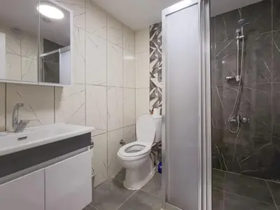 a bathroom with a toilet and a sink and a shower at Taksim Hostel Green House Istanbul in Istanbul