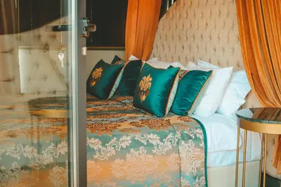 a bedroom with a bed with green and white pillows at Mirart Hotel Boutique & SPA Yalova in Yalova
