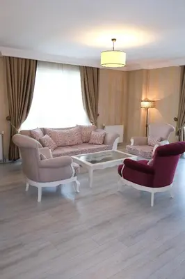 a living room with two couches and a coffee table at Asia City Hotel Istanbul in Istanbul