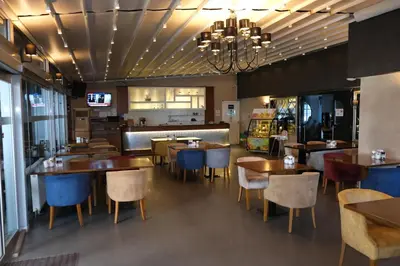 a dining room with tables and chairs in a restaurant at Asia City Hotel Istanbul in Istanbul