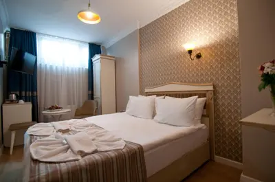 a hotel room with a bed with towels on it at Mevlana Hotel in Istanbul
