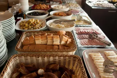 a buffet with bread and other foods on a table at Mevlana Hotel in Istanbul