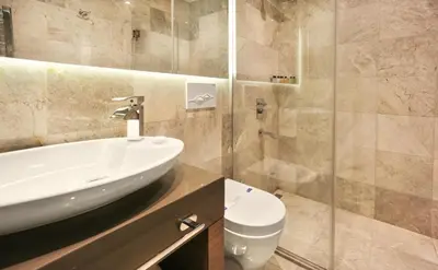 a bathroom with a sink and a toilet at Taksim Premium Hotel in Istanbul