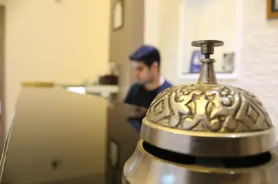 a man standing in a kitchen with a metal object at Retropera Hotel in Istanbul