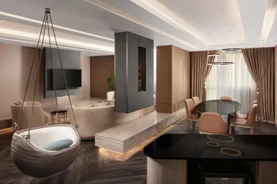 a living room with a tub and a dining room at Sheraton Istanbul City Center in Istanbul