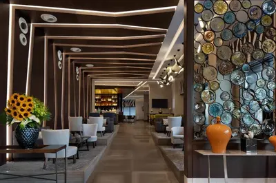 a hallway with chairs and plates on the wall at Sheraton Istanbul City Center in Istanbul